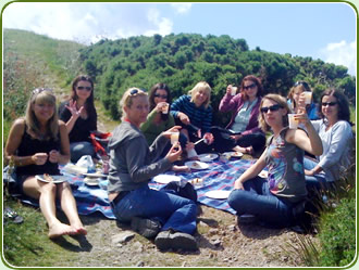 The hens peck at their food at St Agnes Beacon 
(Rhymes with Joey Deacon)